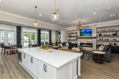 Kitchen featuring pendant lighting, white cabinets