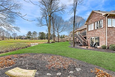 Park-like setting complete with mature trees, a creek and a pond.  