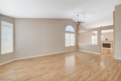 Unfurnished room with ceiling fan, light wood fini