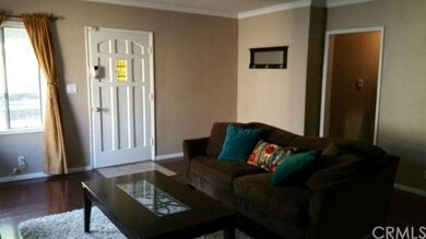 Living room with view towards front door entrance 