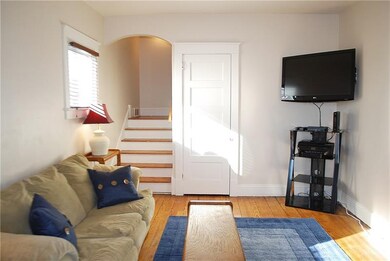 Cozy living room (16x12) with view to upper level.