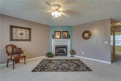 Spacioius living room with fireplace.