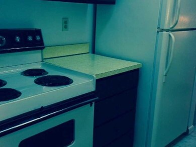 Kitchen. Almond Electric Stove, refrigerator and f