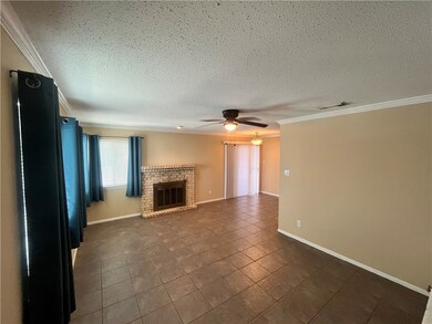 Open living and dining with fireplace