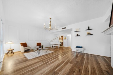 Sitting room with a chandelier and wood finished 