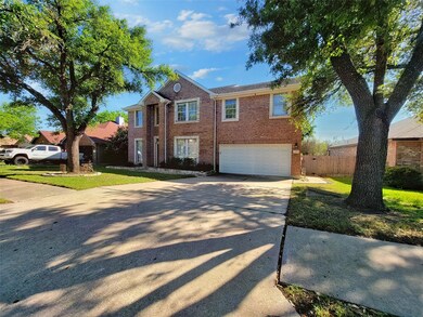 View of front of house with fence, an attached ga