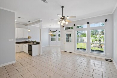 Spacious interior flows between den, kitchen and d