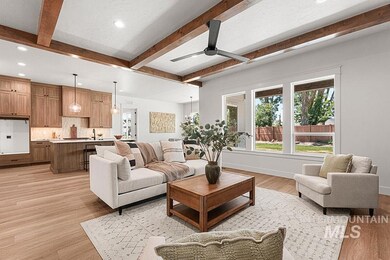 Living area featuring recessed lighting, beamed ceiling, light wood finished floors, and a ceiling fan