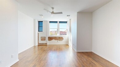 Empty room featuring wood finished floors and ceiling fan