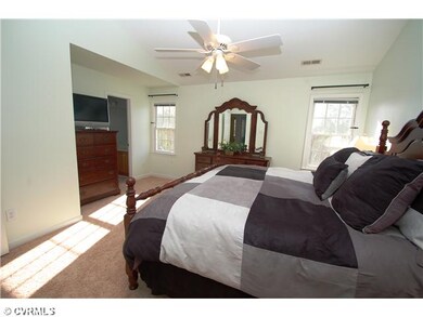 Master Bedroom - A vaulted master suite with a wal