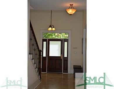 Huge foyer area that shows off the beautiful stair