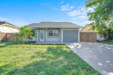 OVERSIZED DRIVEWAY WITH GATE ACCESS TO SIDE YARD