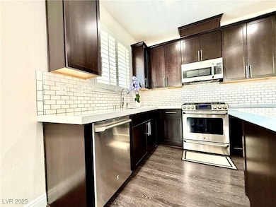 Kitchen featuring light countertops, stainless ste