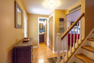 Upon entry, an updated 1/2 bath is located next to