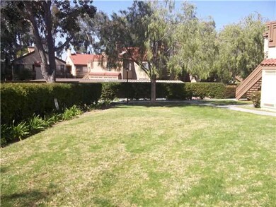 Complex has lots of grassy area & lush landscaping