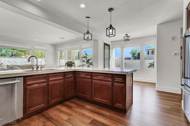 Kitchen with a sink, pendant lighting, appliances