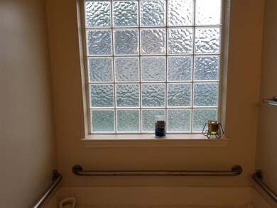 Master Bedroom glass block window over garden tub