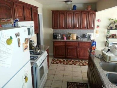 Kitchen with Walnut Cabinets and Granite Counterto