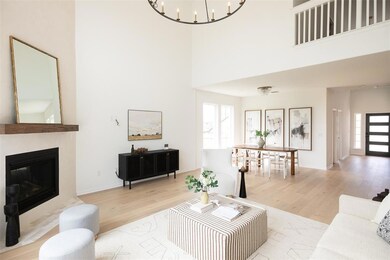 Living room featuring wood finished floors, a tow