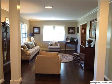 Foyer features columns separating the spaces. Very
