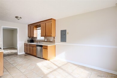 Kitchen featuring electric panel, a sink, tasteful