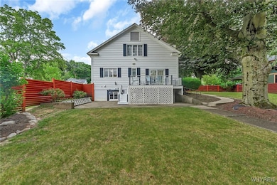 Back of house features deck, concrete patio and di