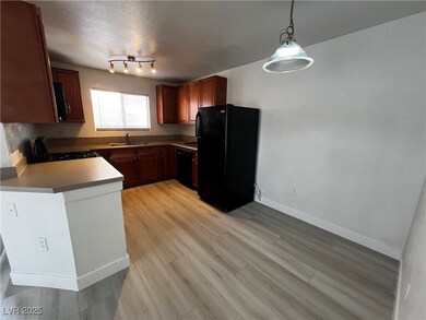 Kitchen with pendant lighting, light wood finished