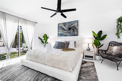 Bedroom featuring ceiling fan and access to exteri