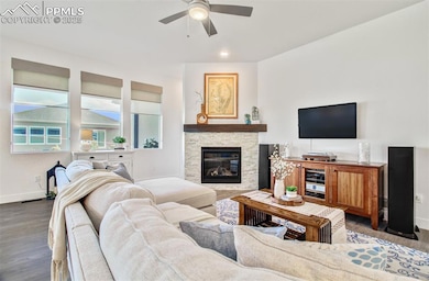 Great room features a stone gas fireplace