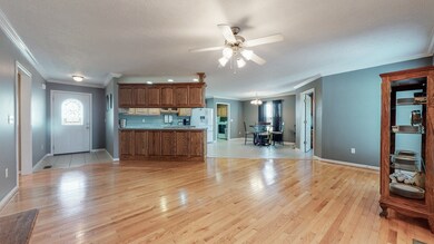 Open layout with eat in kitchen area, formal dining room area and office off of the kitchen. 