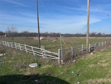 View of yard with a rural view