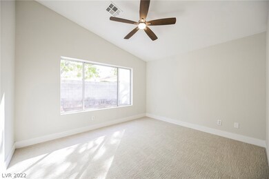STUNNING primary suite with vaulted ceilings and c