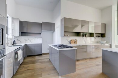 Sleek kitchen design with stainless appliances, mo