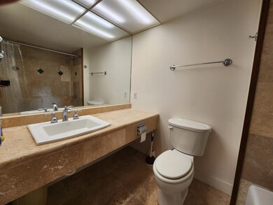 Bathroom features beautiful custom tile work.
