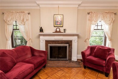 Fireplaced living room off foyer.