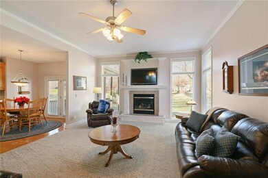 Great room boasts of fireplace, floor to ceiling w