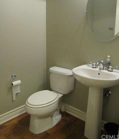 Downstairs powder room with modern look of pedesta