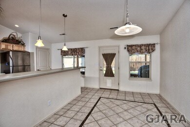 The dining area sits opposite a spacious breakfast
