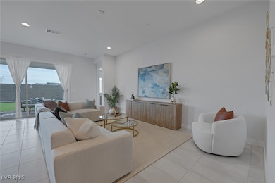Living room featuring light tile patterned floors,