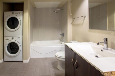 Full bathroom featuring vanity, tiled shower / bat
