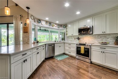 Pass through to lanai, stainless steel appliances, custom pendant lighting & new back splash