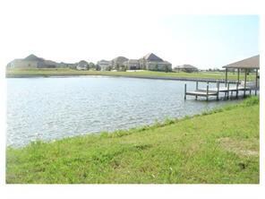 Photo. bulkhead across back of lot.