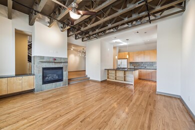 This spacious open-concept living area features ha