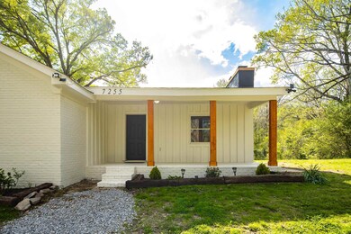 Doorway to property with board and batten siding, 