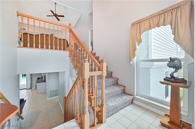 Staircase featuring tile patterned flooring, ceili