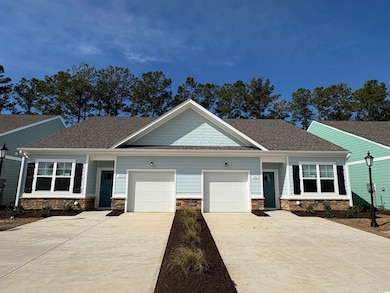 Craftsman house featuring stone siding, roof with 