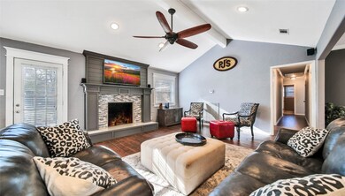 A gas fireplace with an updated mantle is the focal point of this gorgeous room.
