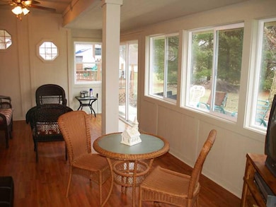 Sun Room. Sun Room adjacent to Family Room, and Deck is finished with insulated glass windows