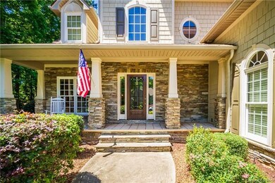 Stacked stone covered front porch perfect for sipp