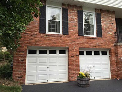 Exterior Front. New Garage doors with Keyless entr